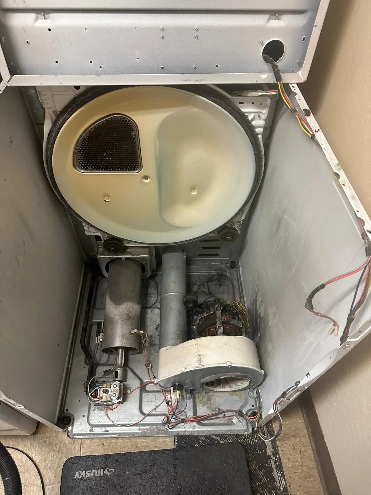 Commercial coin-operated gas dryer after repair and service