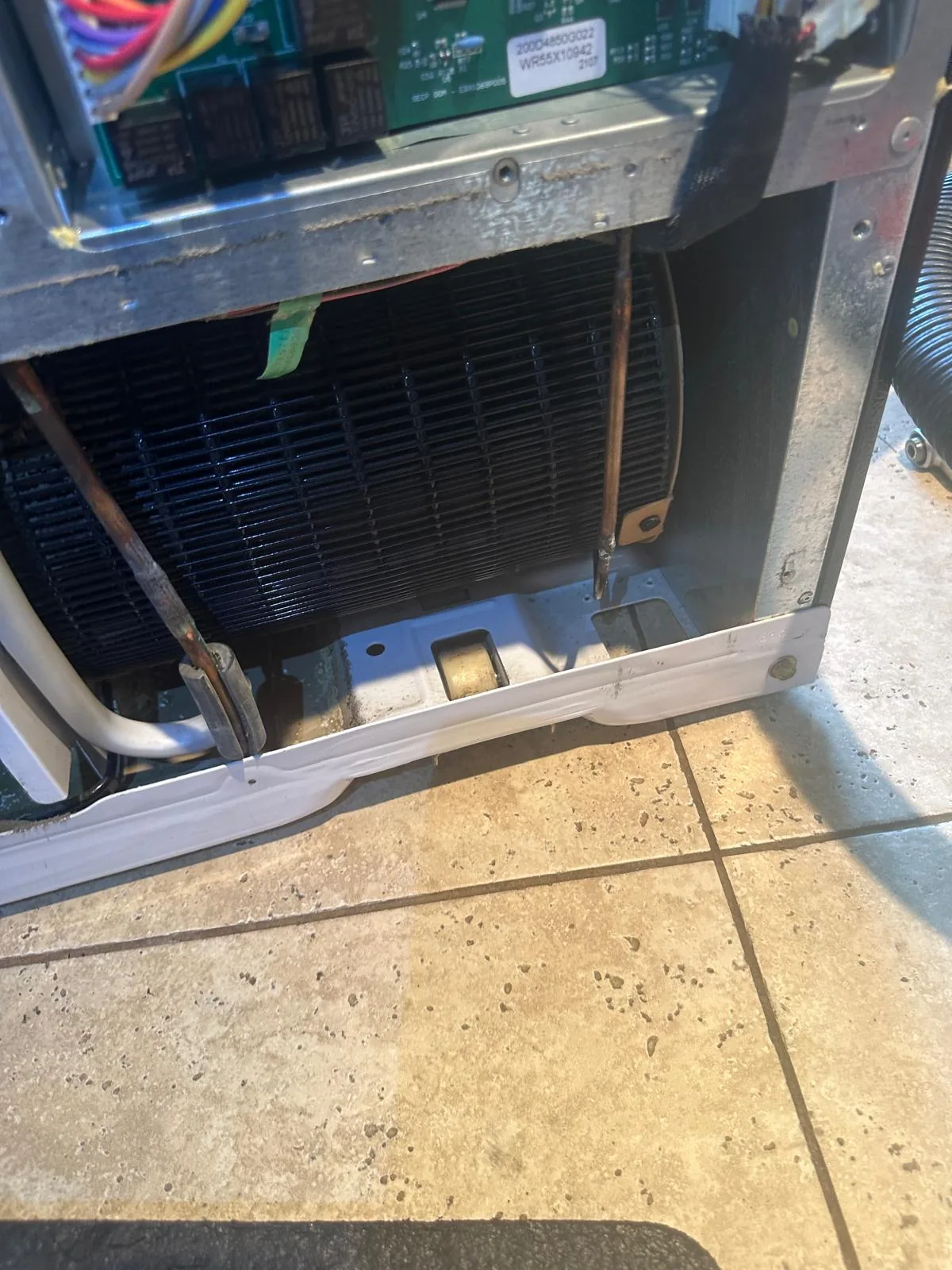 GE refrigerator rear panel after service