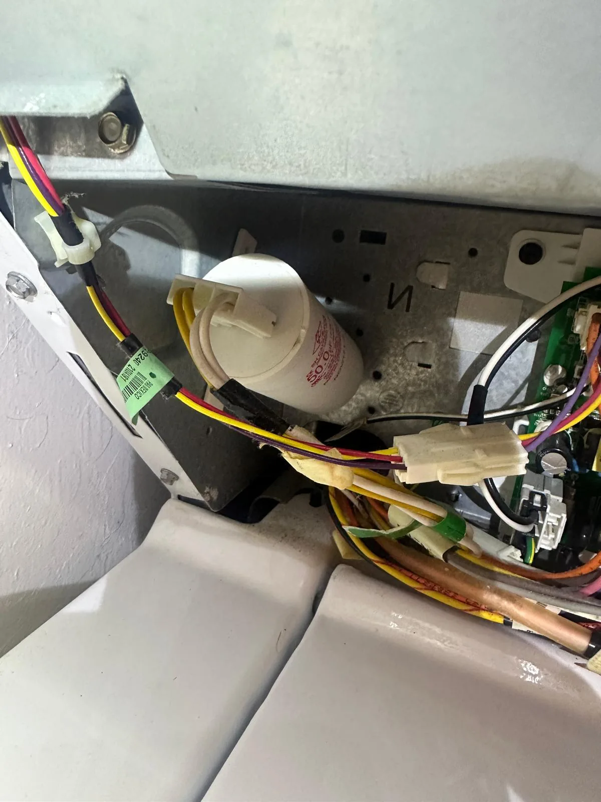 GE washer internal wiring and connections inspected during control board replacement