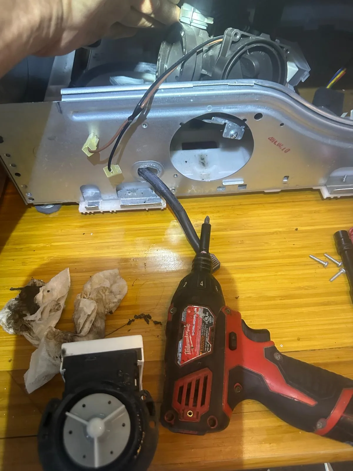 Failed drain pump motor removed from Kenmore washer during repair