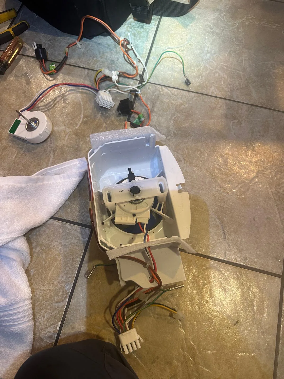 Clean frost-free evaporator coils after defrost repair and fan motor replacement
