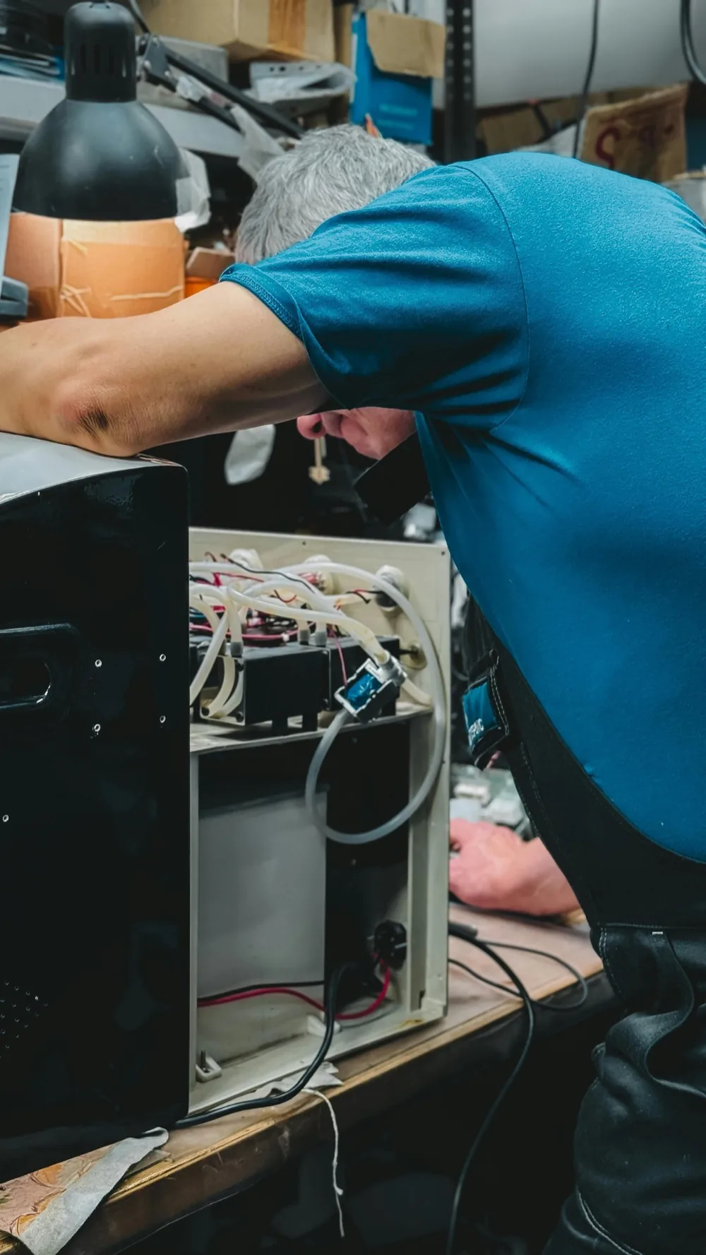Technician repairing a refrigerator